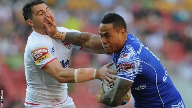 Samoa's Tim Simona brushes off England's Matty Smith