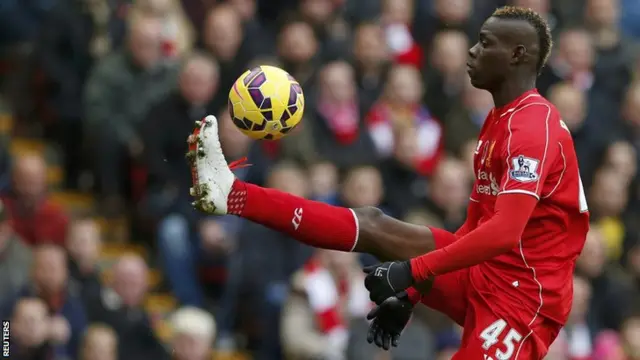 Liverpool striker Mario Balotelli controls the ball