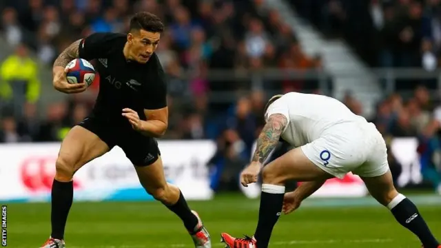 Sonny Bill Williams of New Zealand is tackled by Joe Marler of England