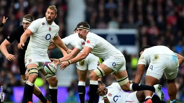 Tom Wood of England passes watched by Chris Robshaw