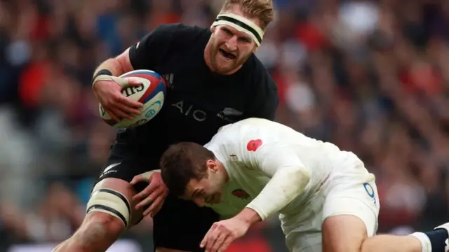 New Zealand's Kieran Read is tackled by England's Jonny May