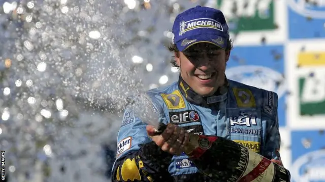 Fernando Alonso of Spain and Renault celebrates on the podium after the Brazilian Formula One Grand Prix at Interlagos Circuit on October 22, 2006 in Sao Paulo, Brazil.