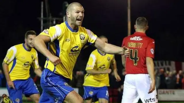 Warrington Town's Craig Robinson celebrates scoring against Exeter on Friday