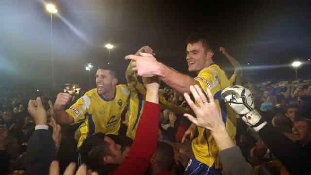 Warrington Town celebrate beating Exeter 1-0 on Friday evening