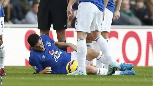 Gareth Barry lies on the ground injured