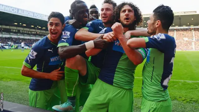 Newcastle celebrate after scoring their second goal against West Brom