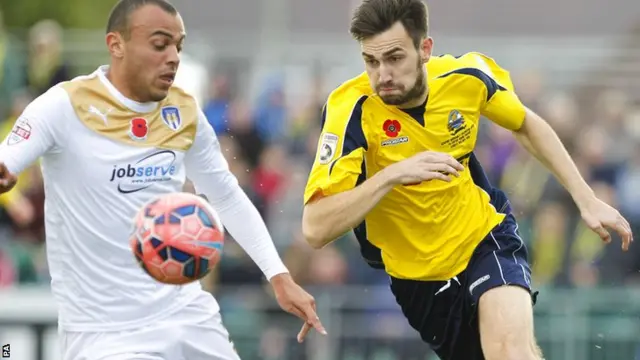Gosport Borough Dan Wooden takes on Colchester's Ben Gordon