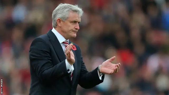 Mark Hughes celebrates after Stoke's win over Tottenham Hotspur