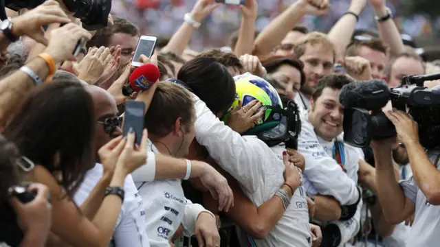 Massa's technical team congratulate him after finishing 3rd at Brazilian Grand Prix