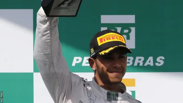 Lewis Hamilton with 2nd place trophy at Brazilian Grand Prix