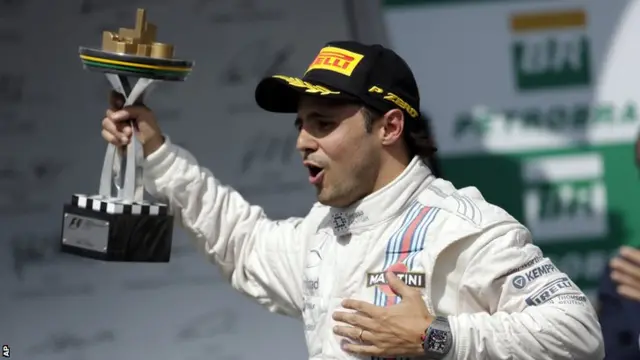 Felipe Massa celebrates finishing 3rd at the Brazilian Grand Prix