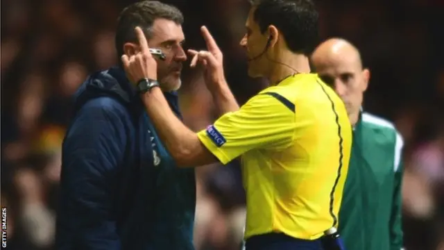 Roy Keane talks to the referee