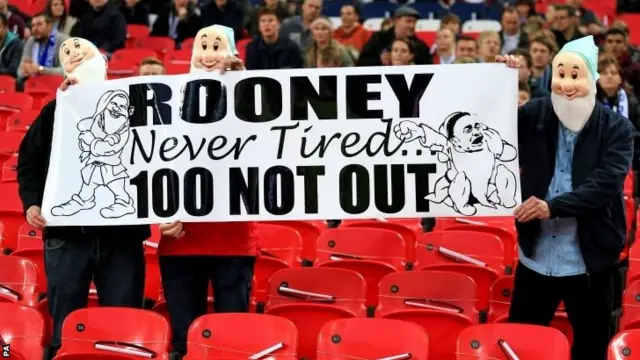 Fans with Wayne Rooney banner