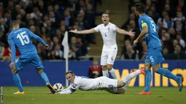 Wayne Rooney is brought down for a penalty