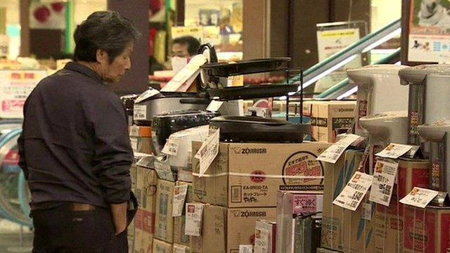 Man looks at shop display