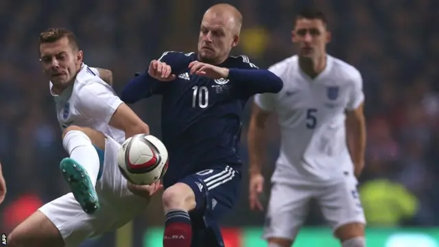 England's Jack Wilshere and Scotland's Steven Naismith