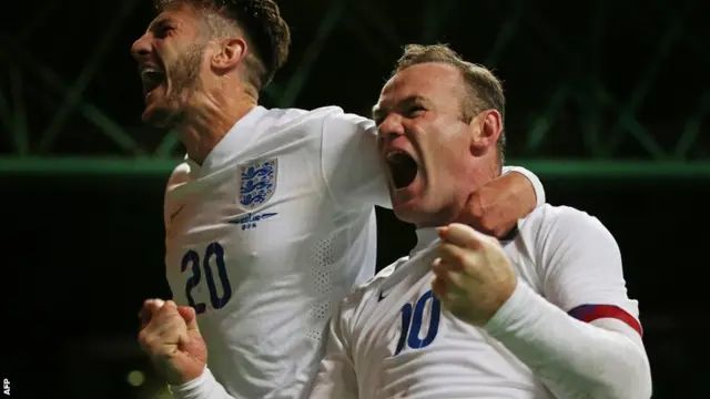 Wayne Rooney and Adam Lallana celebrate