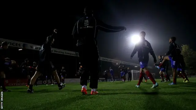 Aldershot Town warm up for their FA Cup first-round replay against Portsmouth