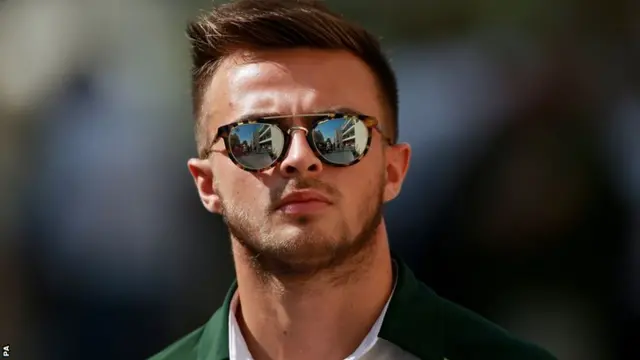 Caterham's Will Stevens in sunglasses after practice one at the season-ending Abu Dhabi Grand Prix