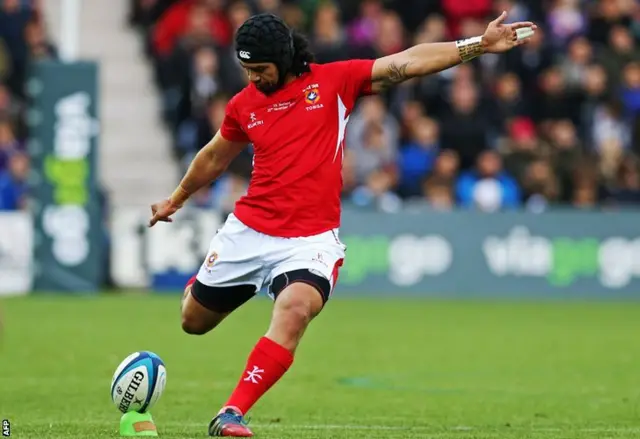 Tonga"s fly half Latiume Fosita kicks a penalty