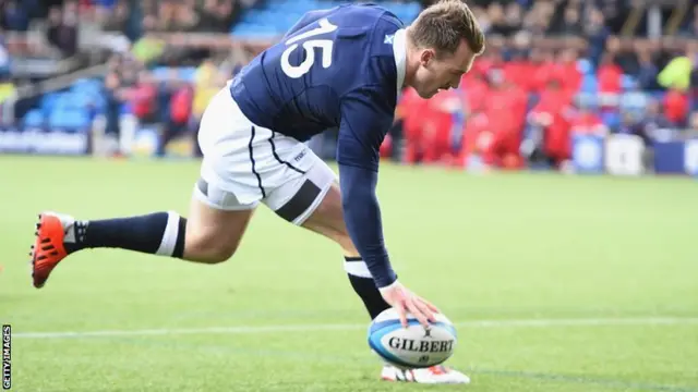 Stuart Hogg of Scotland scores a try against Tonga