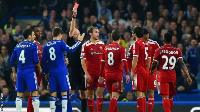 Claudio Yacob is shown a red card