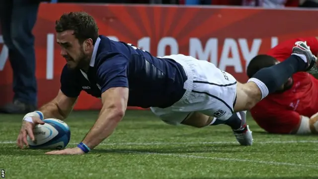 Scotland"s centre Alex Dunbar scores a try