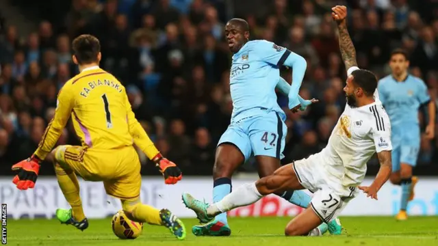 Manchester City midfielder Yaya Toure scores