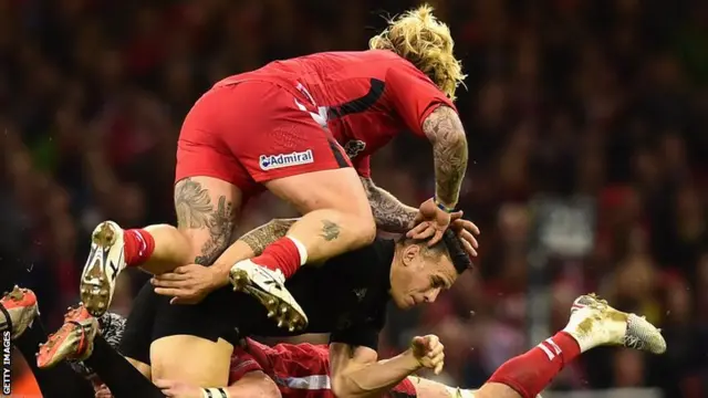 Wales hooker Richard Hibbard tackles New Zealand centre Sonny Bill Williams