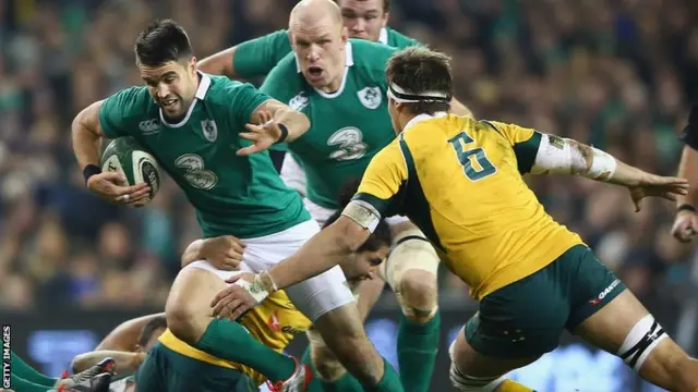 Conor Murrray of Ireland is tackled by Luke Jones of Australia