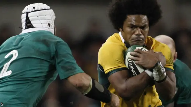 Australia's Henry Speight, centre, is tackled by Ireland's Rory Best