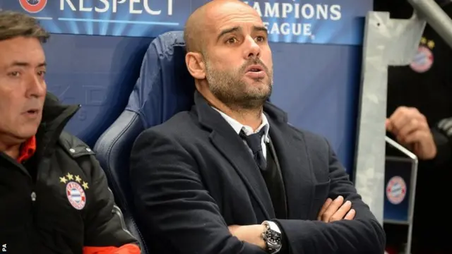 Pep Guardiola looks on