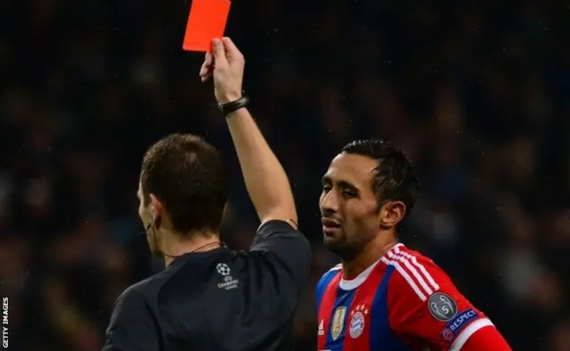 Medhi Benatia show a red card