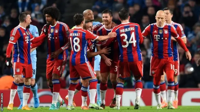 Xabi Alonso celebrates with his teammates