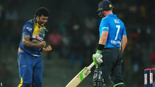 Sri Lankan cricketer Thisara Perera celebrates after dismissing England cricketer Ian Bell