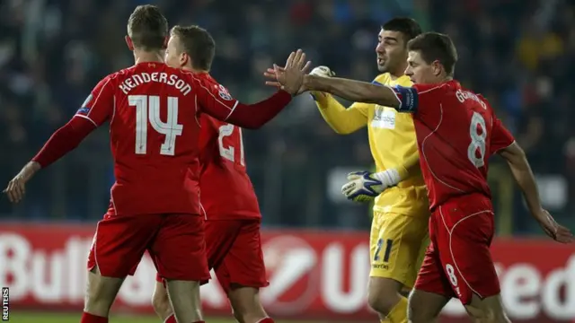 Liverpool's Jordan Henderson is congratulated by Steven Gerrard