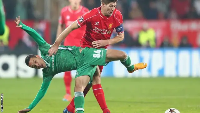 Liverpool captain Steven Gerrard vies for the ball