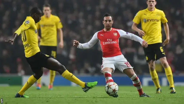 Santi Cazorla is caught by Adrian Ramos