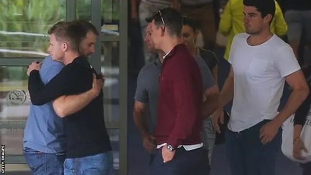 Players console each other at St Vincent's Hospital, Sydney. 27 Nov 2014