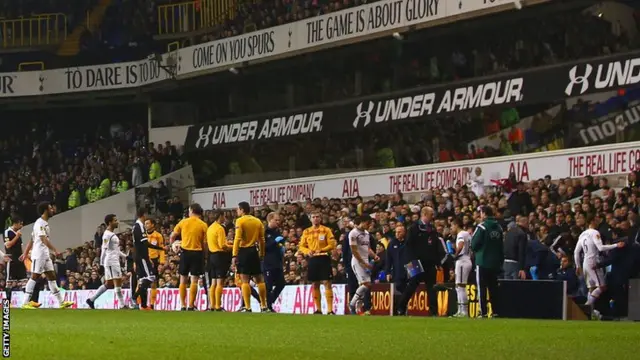 Tottenham players leave the pitch