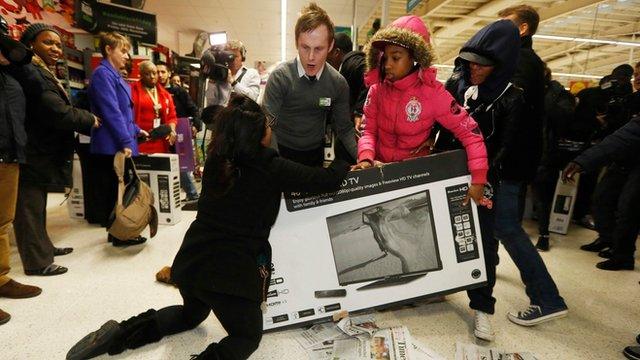 Shoppers wrestle over a TV