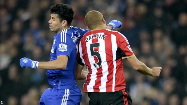 Diego Costa gets a yellow for his challenge on Wes Brown