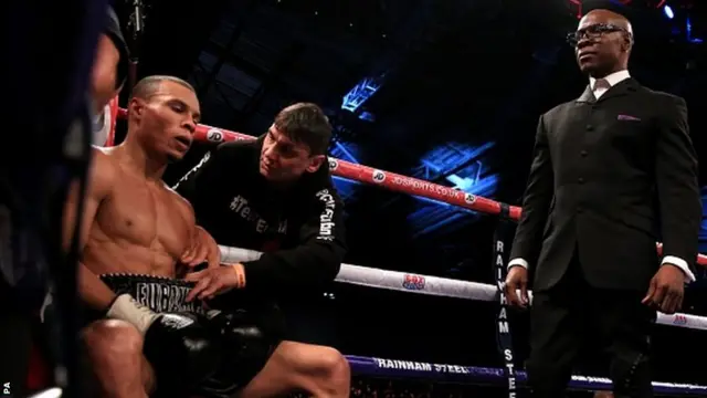 Chris Eubank Junior sits in his corner, over seen by his father Chris Eubank