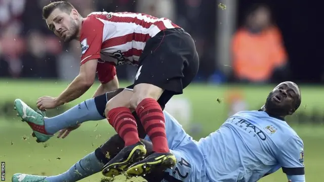 Manchester City's Yaya Toure tackles Southampton's Morgan Schneiderlin