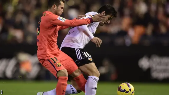 Jordi Alba battles for the ball