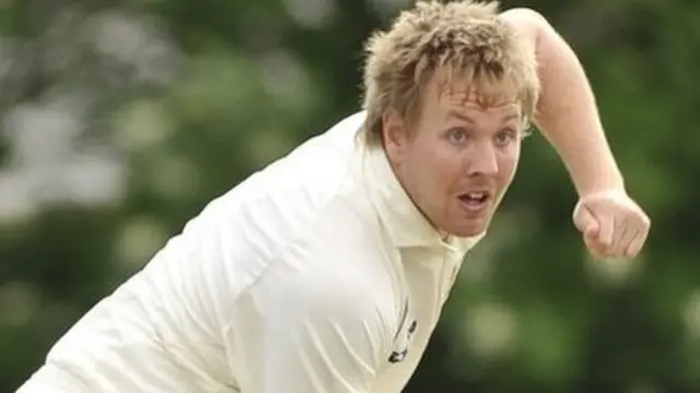 Rob Elliot bustles in to bowl