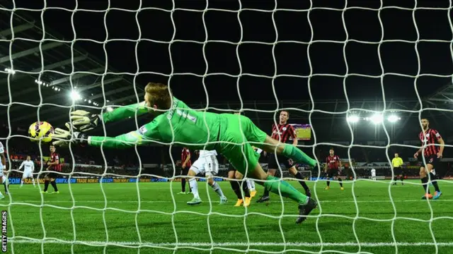 QPR goalkeeper Robert Green makes a save