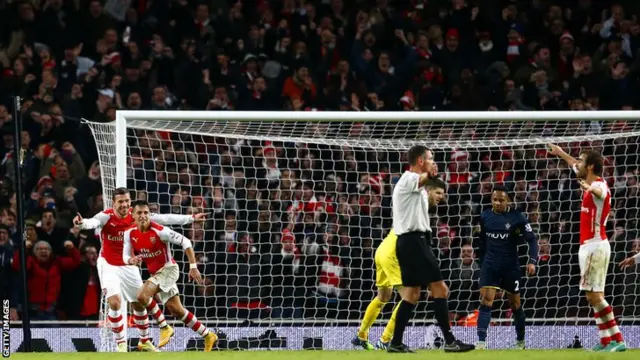 Alexis Sanchez celebrates with his Arsenal team mates