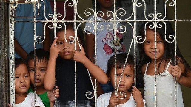 Children in school that has been turned into a shelter