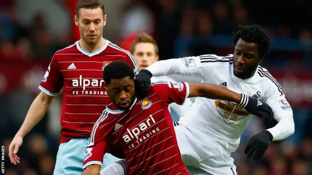 Alexandre Song of West Ham and Wilfried Bony of Swansea City